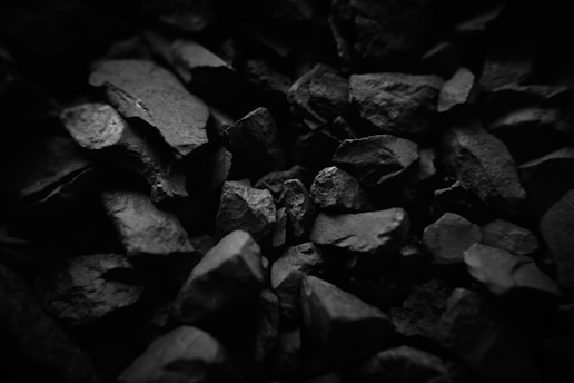 Pile of dark gray rocks in black and white.