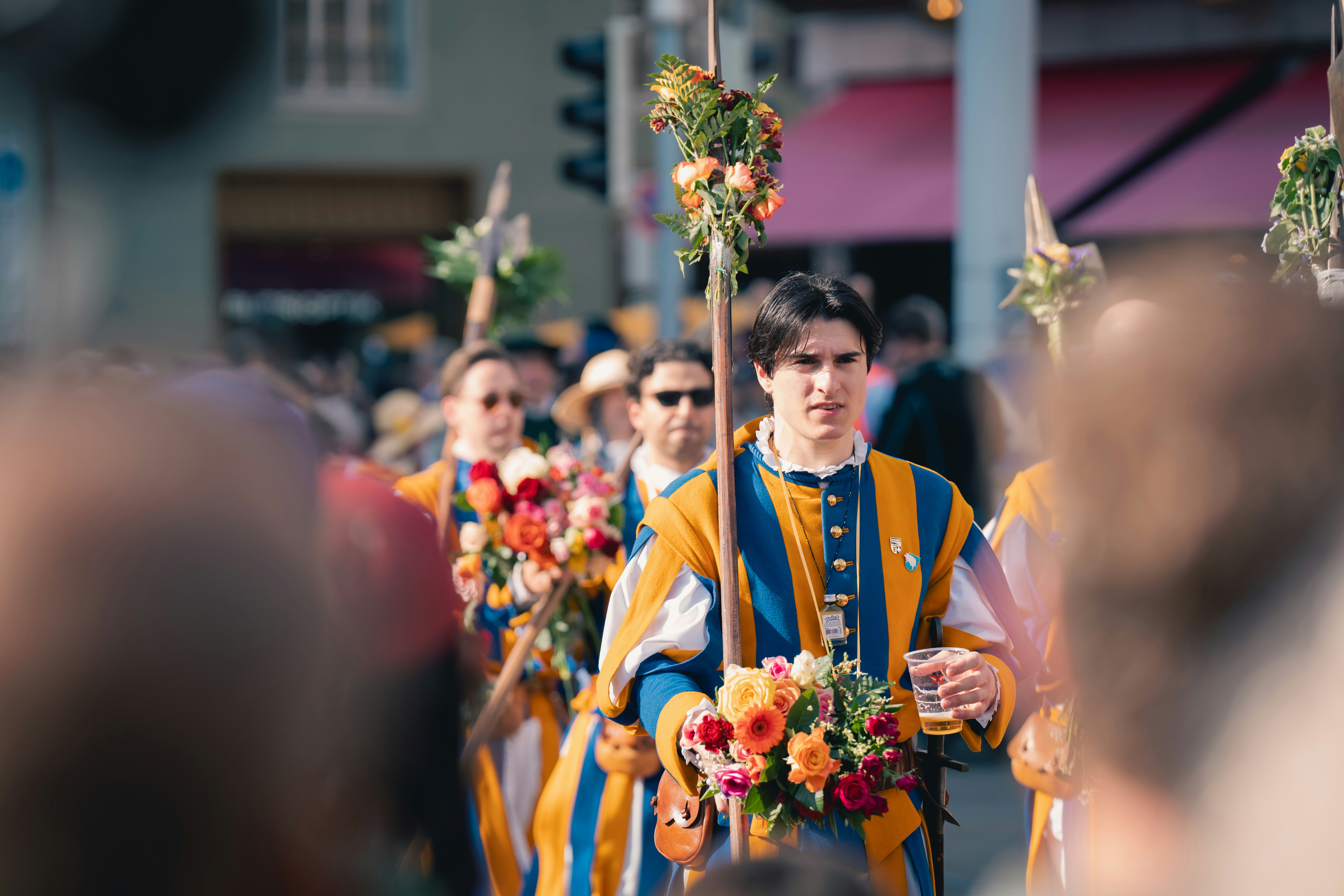 Men in costumes march in a parade. photo – Free Image on Unsplash