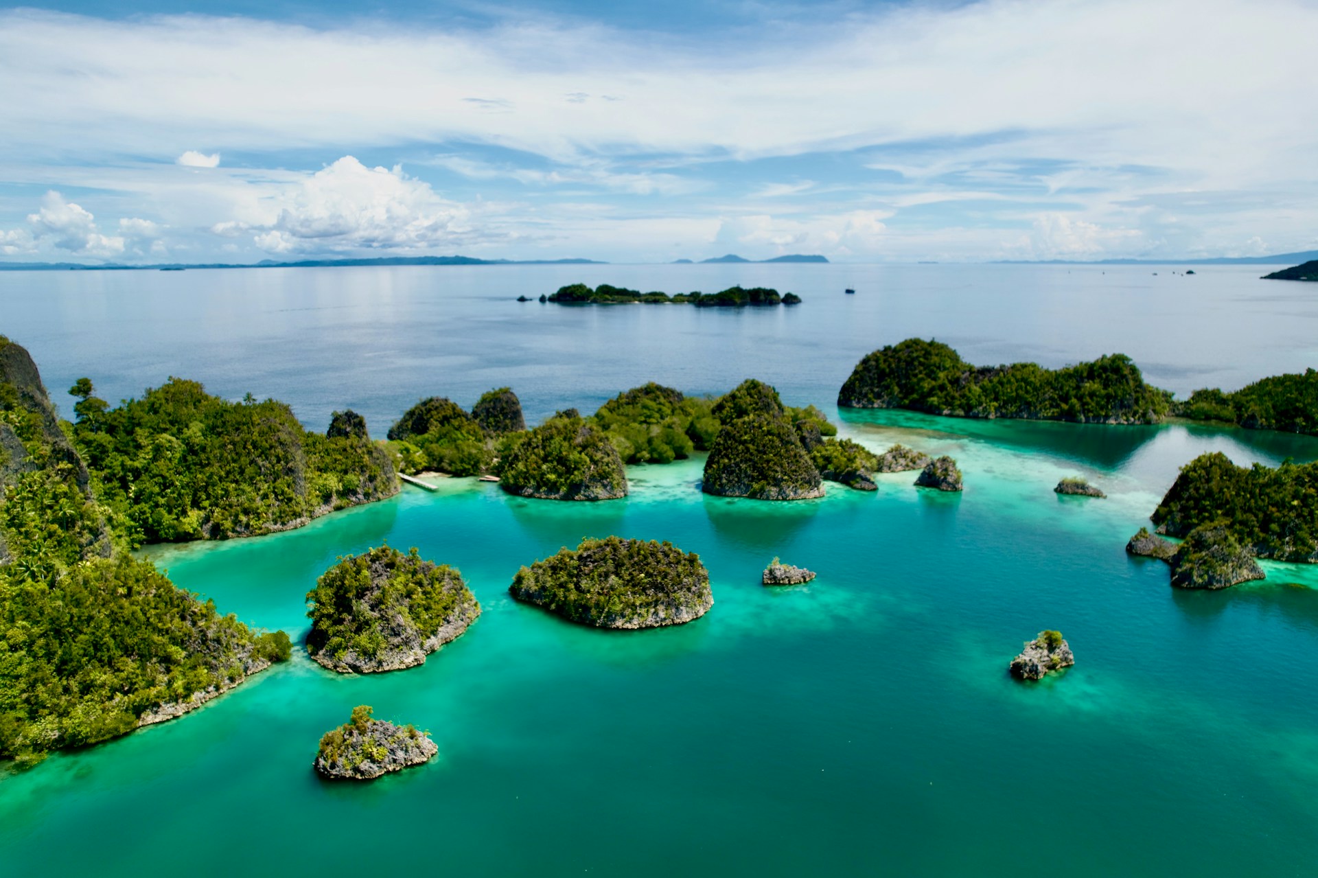 Islands and turquoise waters create a stunning landscape.