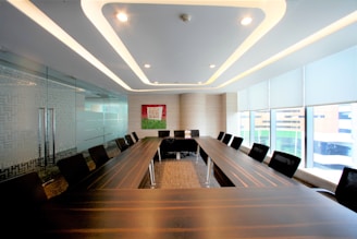 A modern conference room is prepared for meetings.