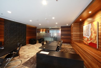 An office space with wooden panels and tables.