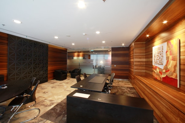 An office space with wooden panels and tables.