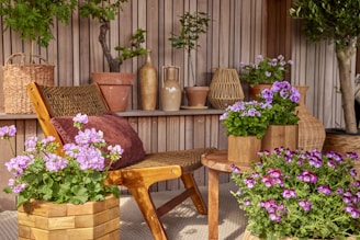 A relaxing outdoor patio with flowers and plants.