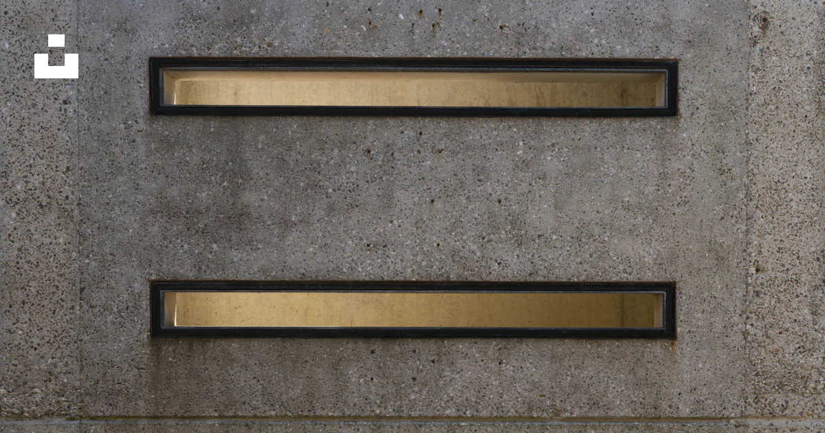 Three rectangular openings are in a concrete wall. photo – Free ...