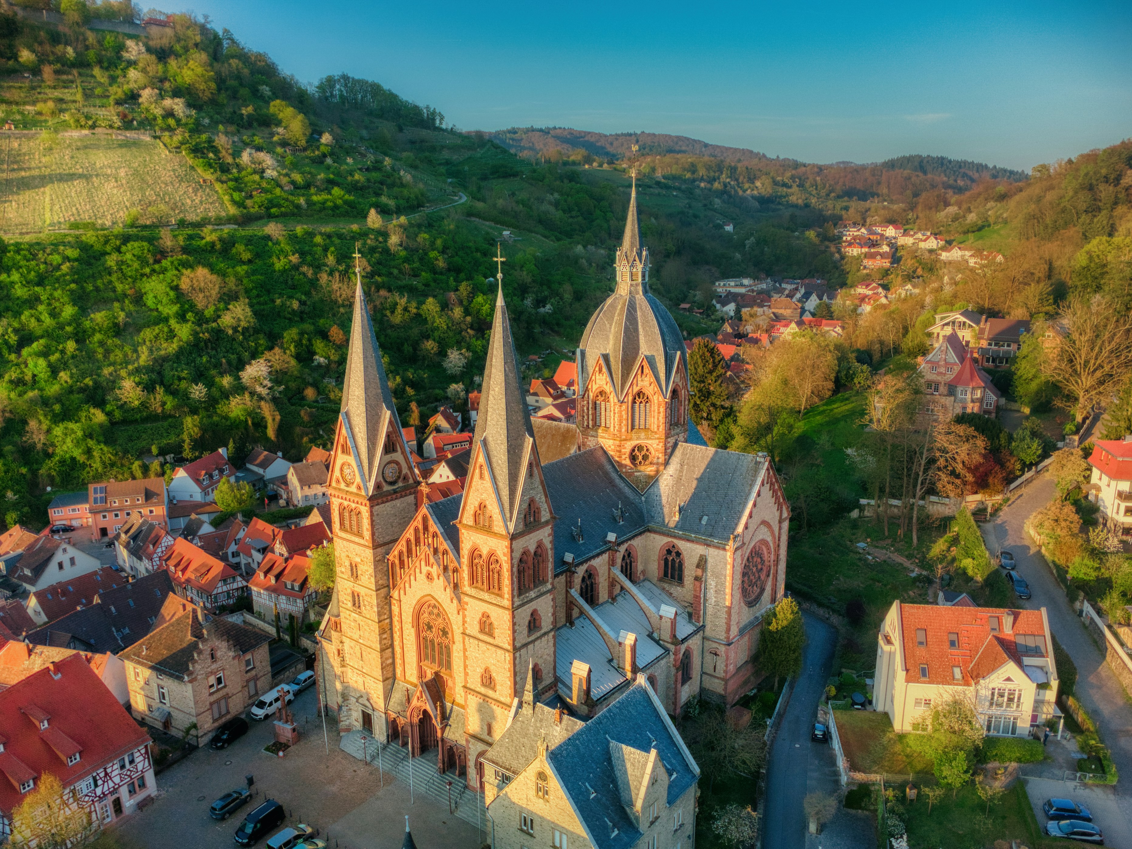 A church towers over a charming european town.