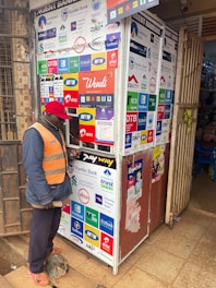 A man uses an atm kiosk.