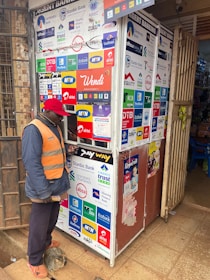 A man uses an atm kiosk.
