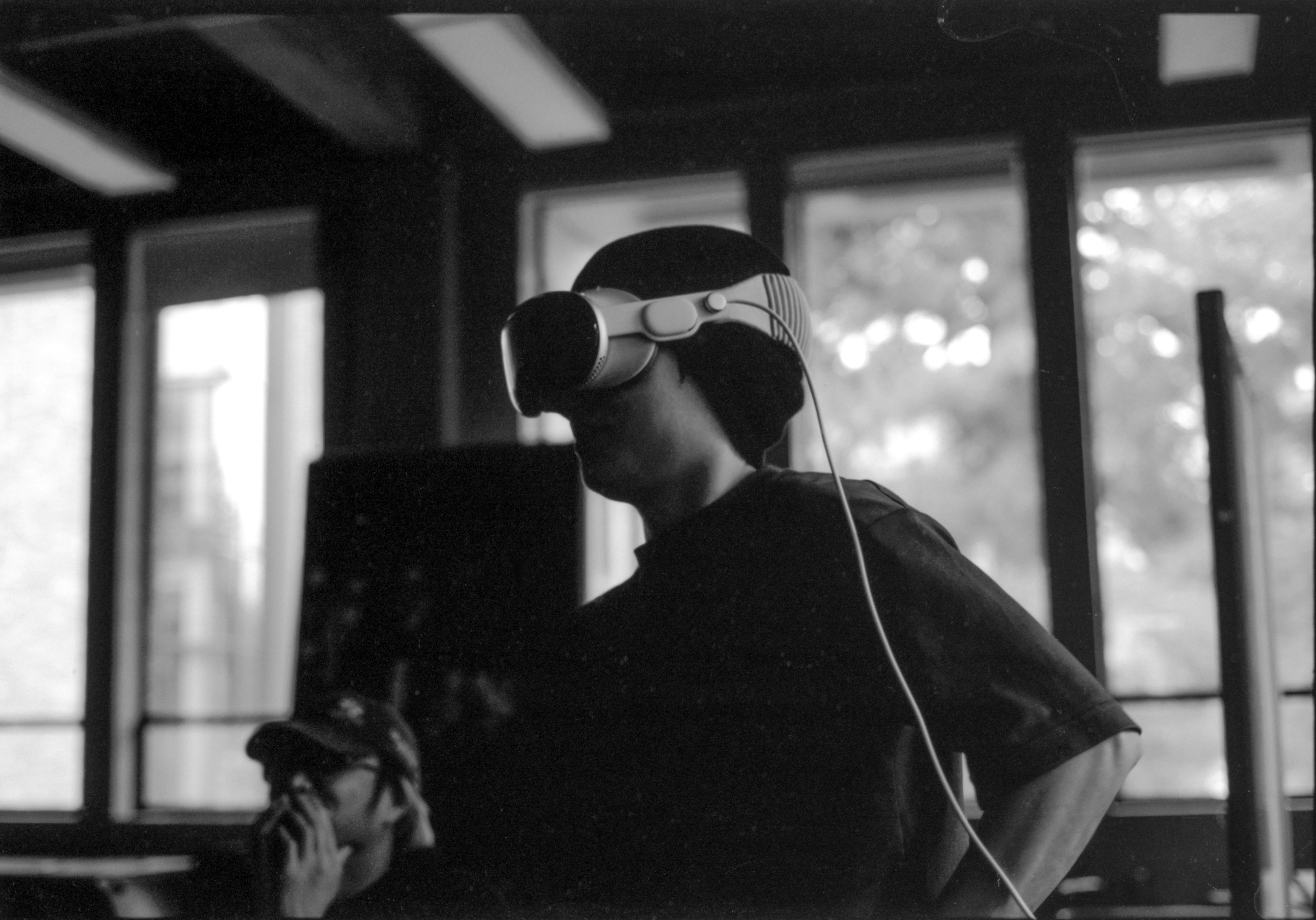 user wearing a VR headset at a hybrid event - virtual reality exhibits for conferences