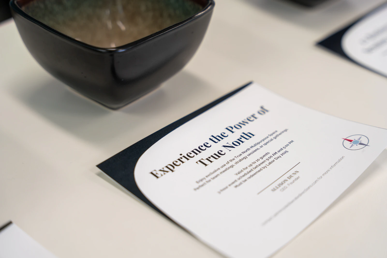 Compliance documents and certificates spread on a desk next to raw cotton fiber samples