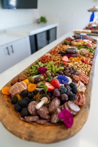 A large charcuterie board filled with delicious food.