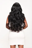 Woman poses with long, flowing, black hair