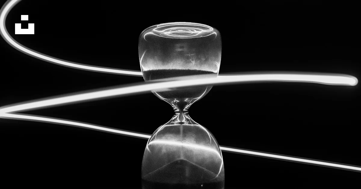 An hourglass and light trails reflect time. photo – Free Hourglass ...