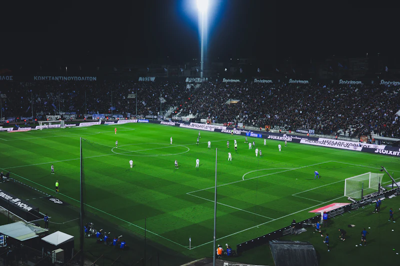 Floodlit football game at night