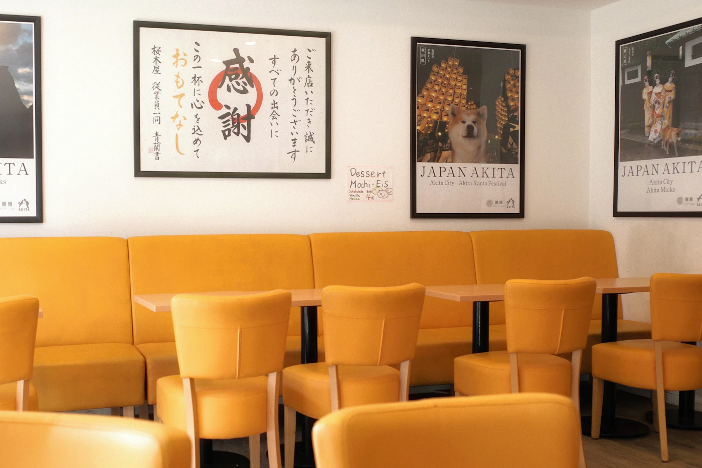 Japanese restaurant interior with warm wood and yellow seating