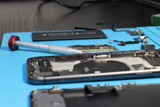 An iPhone is being repaired with components