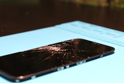 Cracked smartphone screen needs repair.