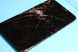 Shattered phone screen: a glaring display of damage.