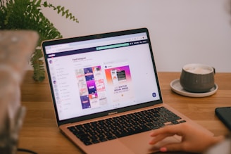 Person uses a laptop with a webpage on display.