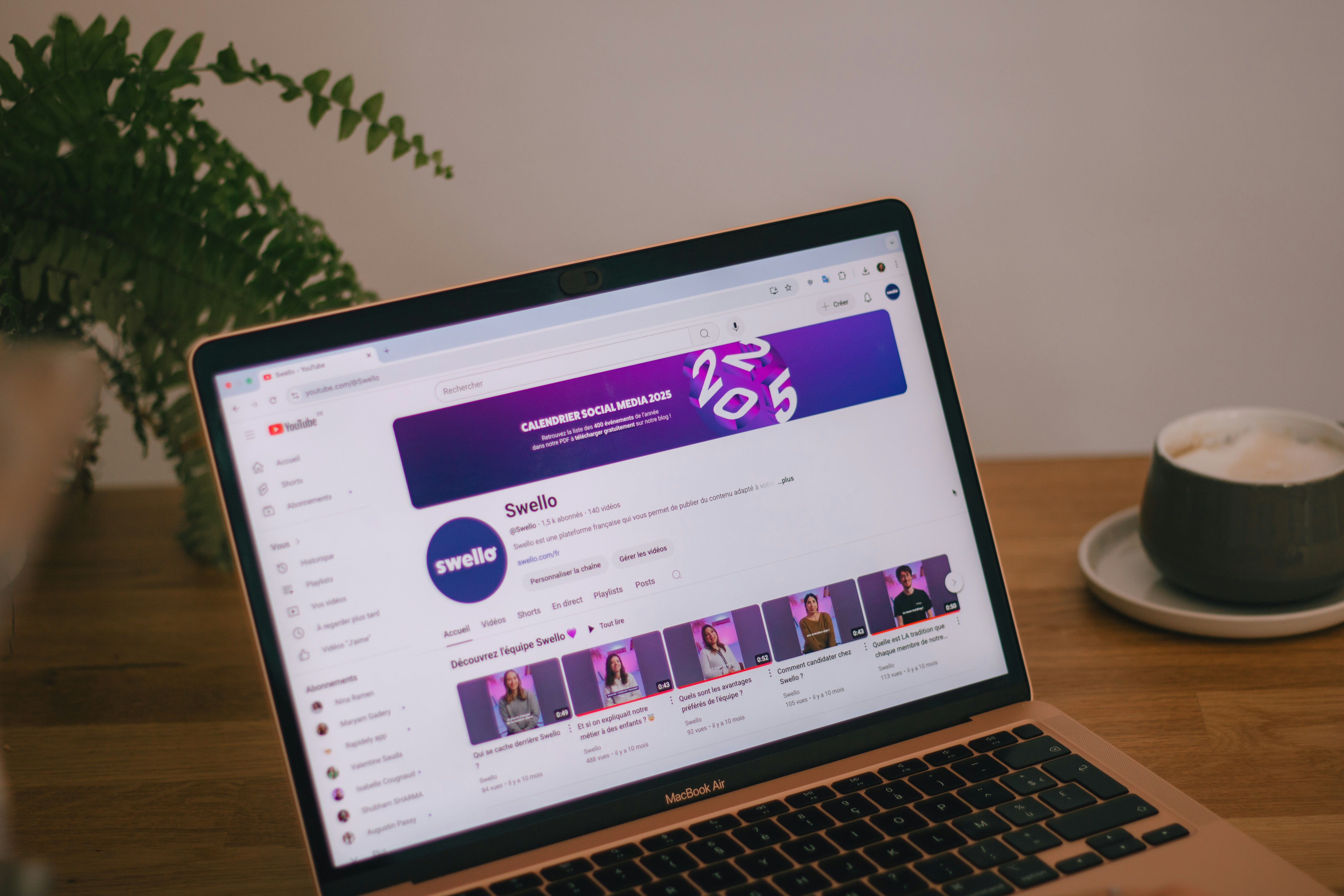 A computer displays a schedule app with videos about making a YouTube faceless channel, using YouTube automation music