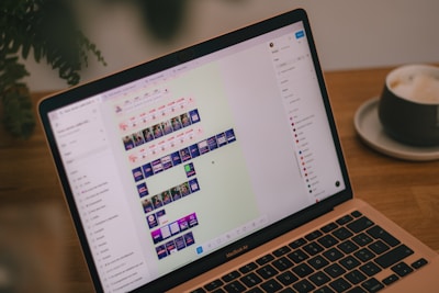 A laptop screen displays video editing software.