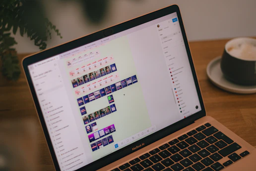 A laptop screen displays video editing software.
