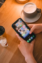 Someone is using their phone with social media apps.