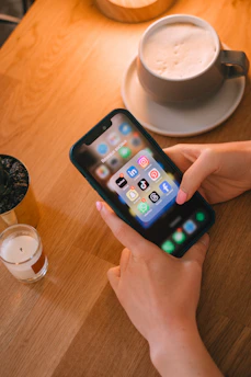 Someone is using their phone with social media apps.