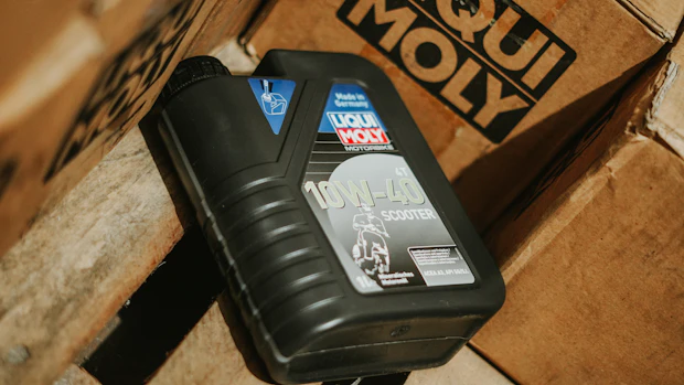 Automotive lubricant bottle and maintenance product packaging