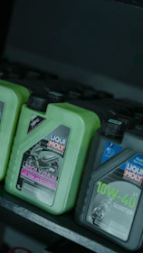 Motorcycle oil bottles on a shelf