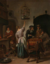 People gathered around a table in a dimly lit room.