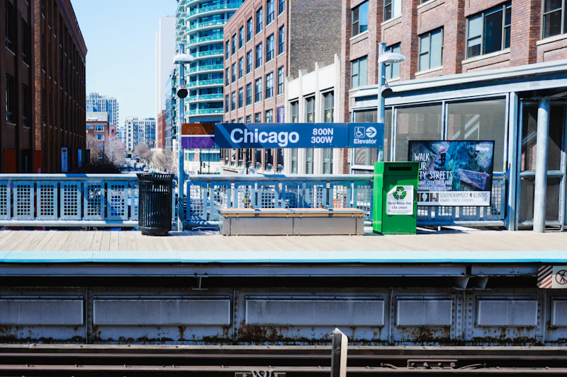 A CTA elevated station platform sign reading 'Chicago' in the River North neighborhood
