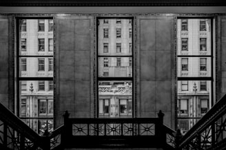 Windows show buildings framed by walls.