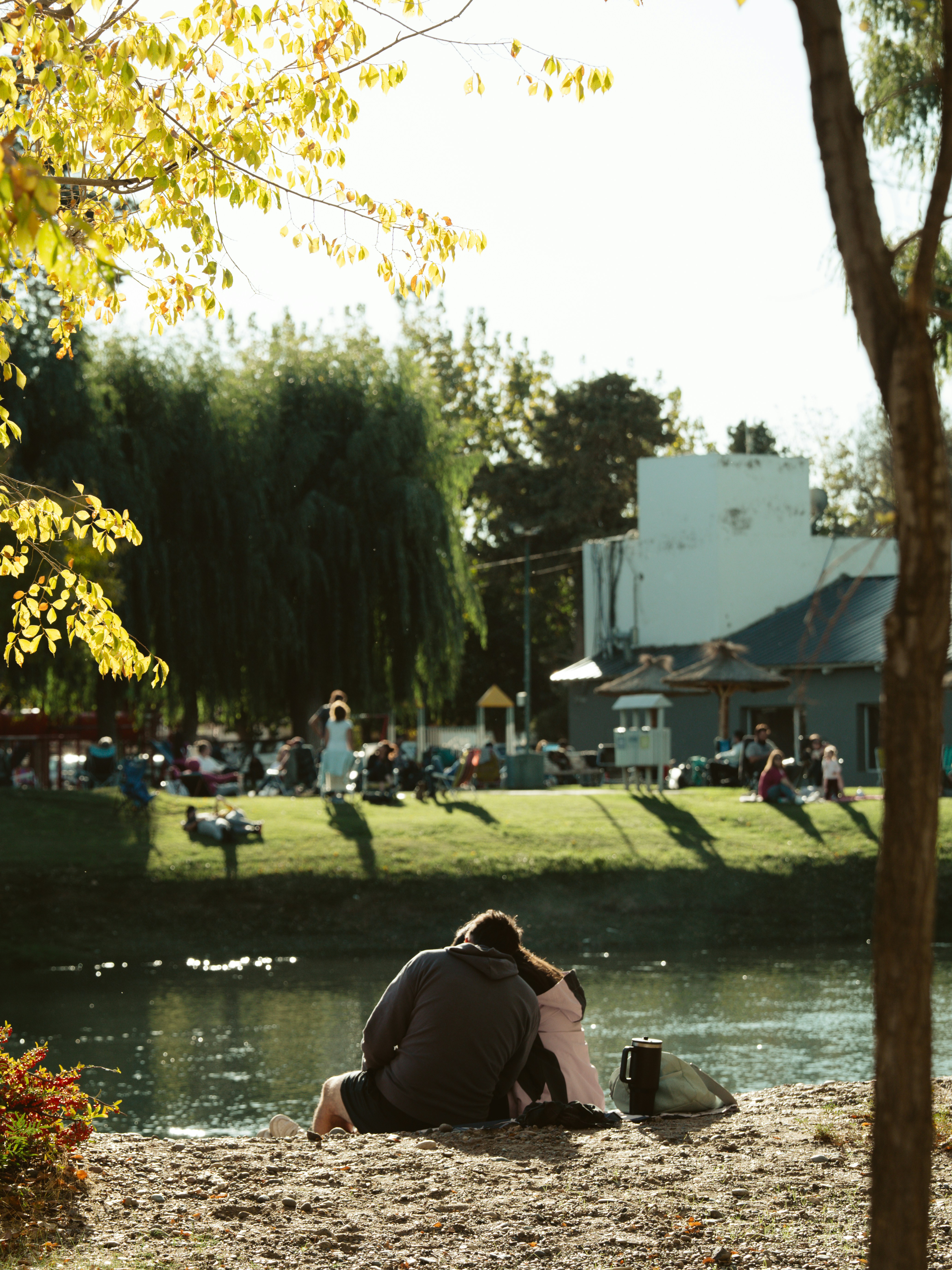 Couple enjoys a sunny day by the water