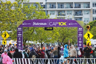 Runners gather at the statesman cap10k finish line.