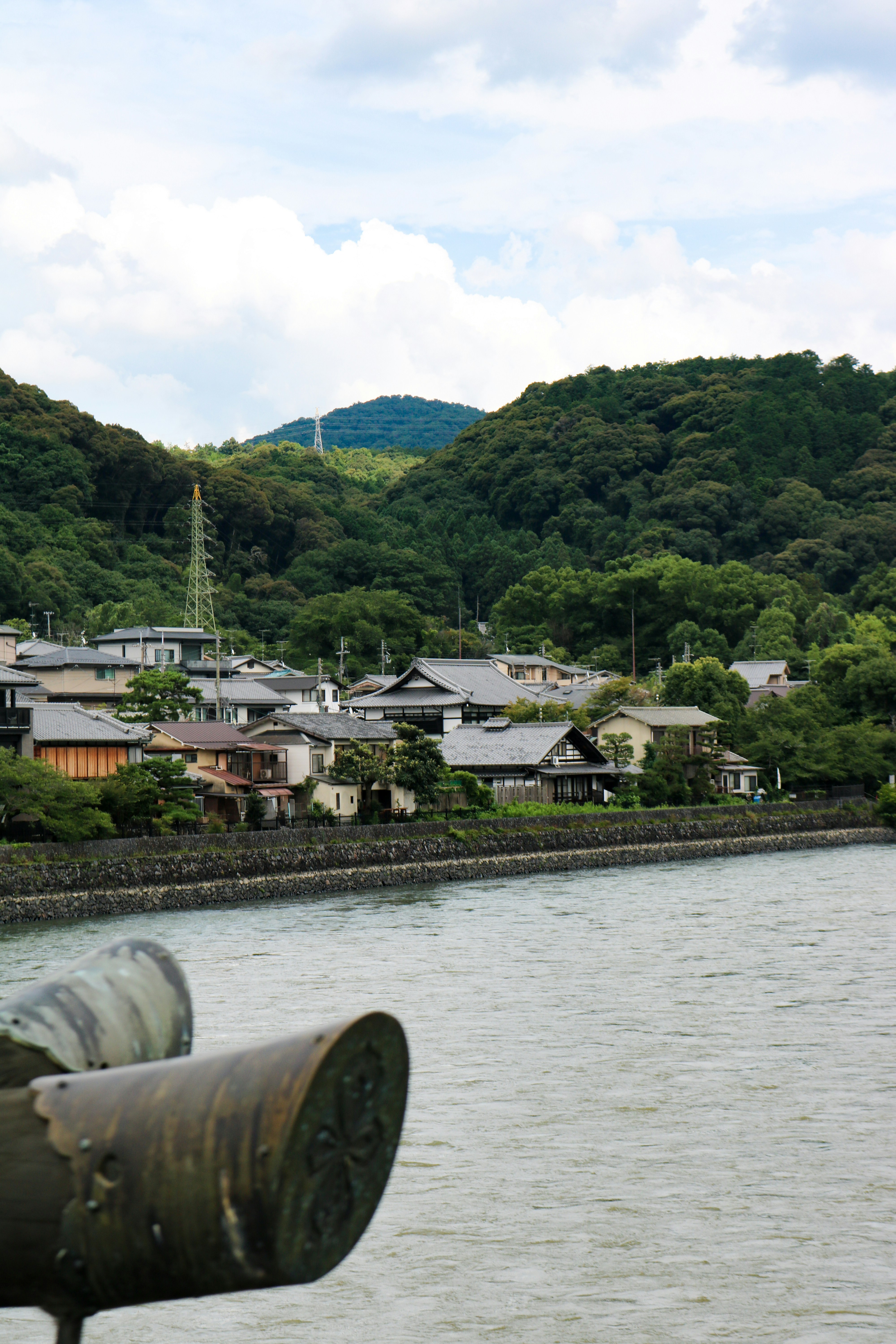 A picturesque japanese village by a river.