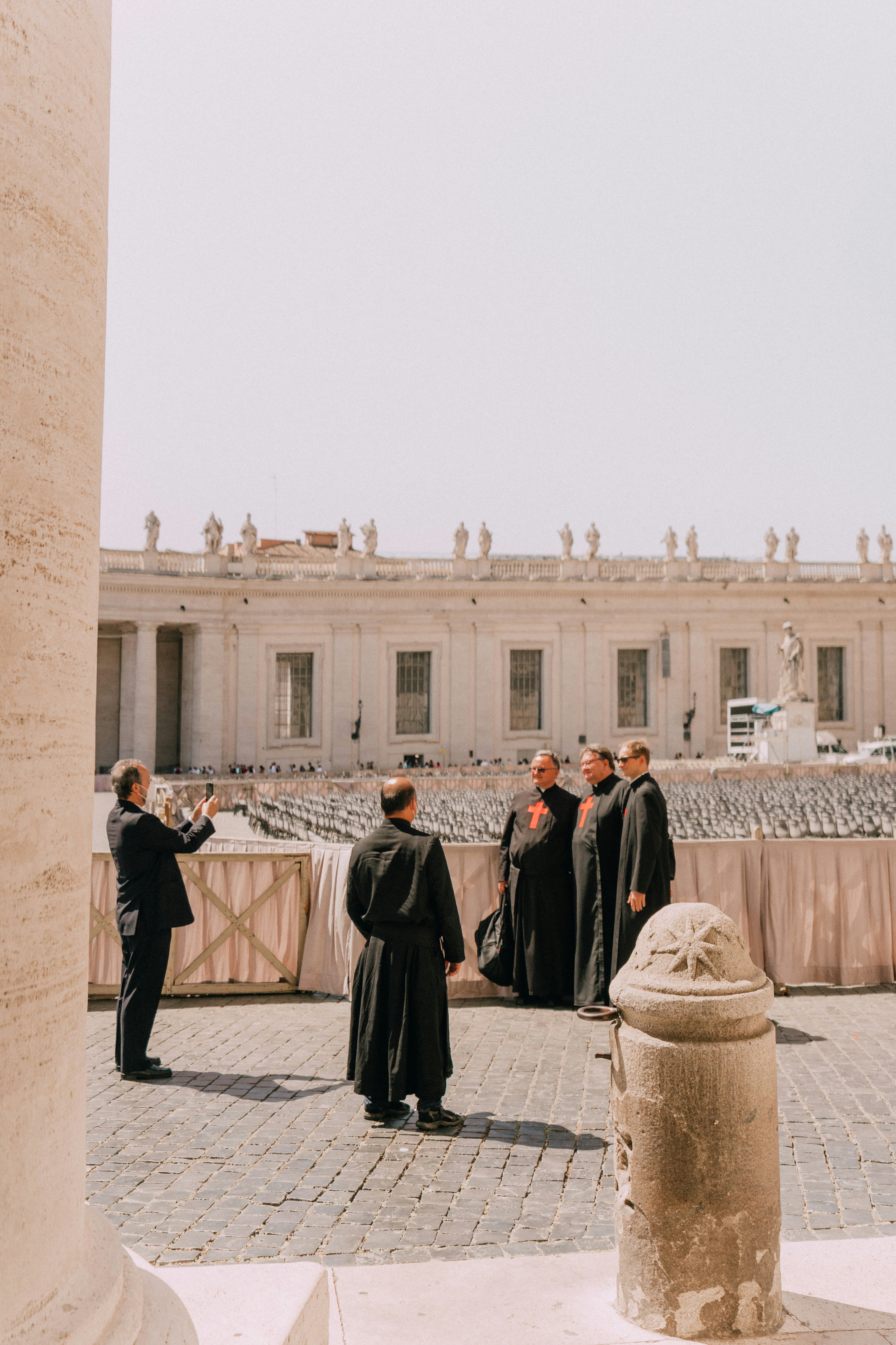 Men in robes pose for a photo in vatican city.