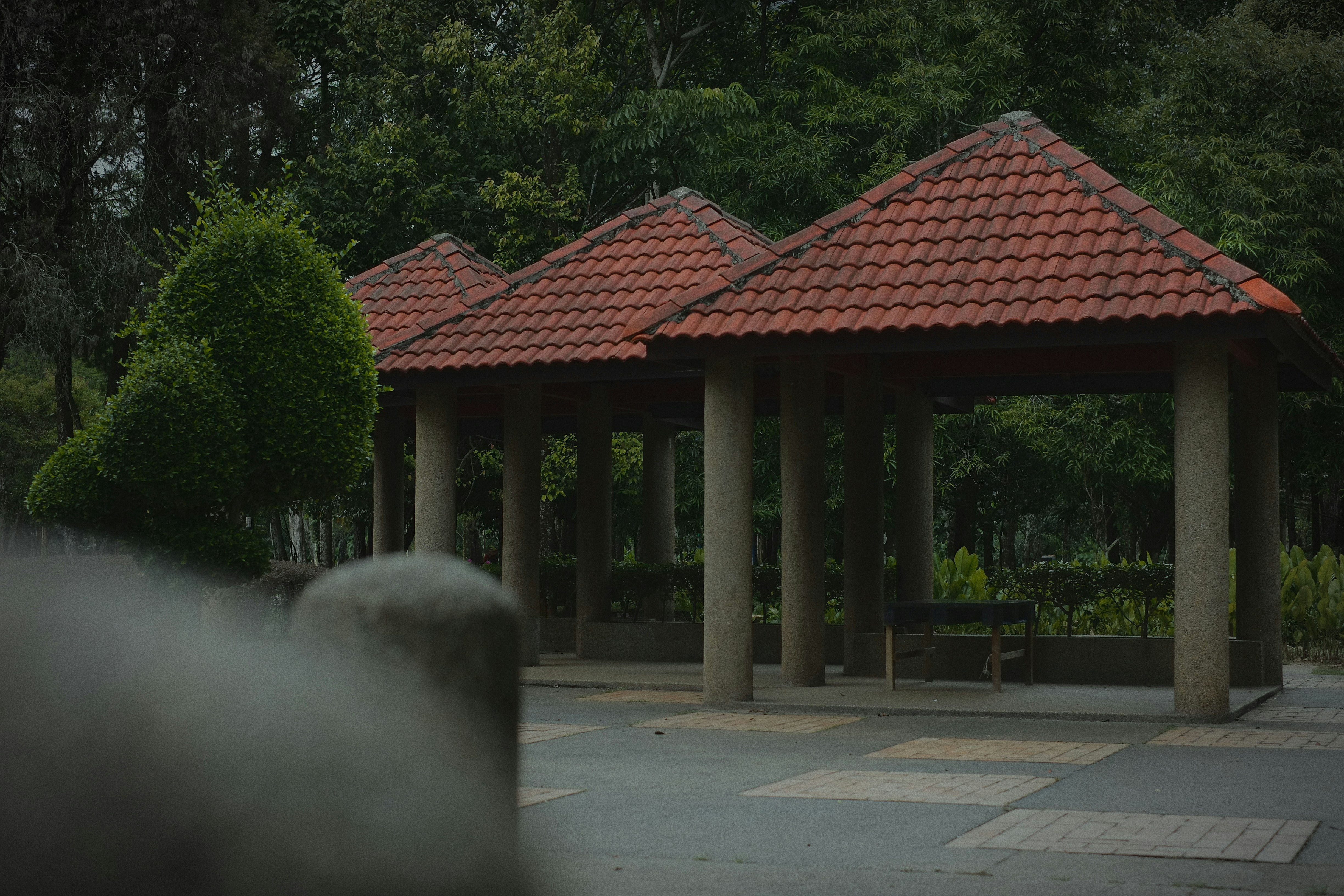 Gazebos stand ready in a tranquil park.