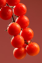 A cluster of fresh, ripe cherry tomatoes.