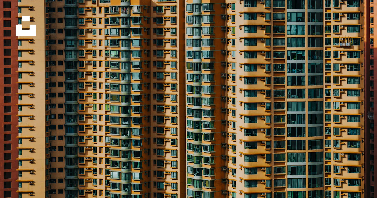 Tall buildings with many identical windows are shown. photo – Free ...