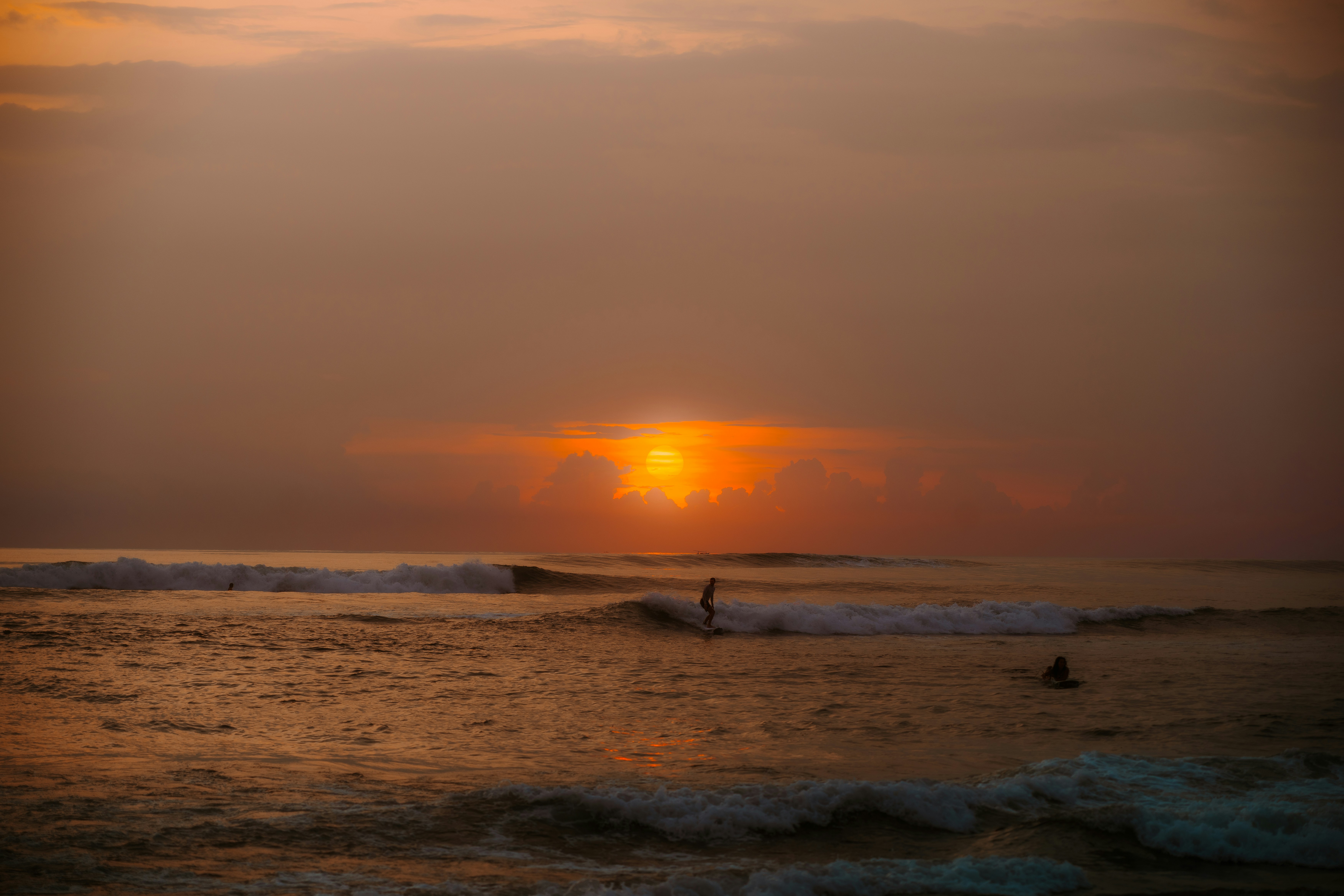 Canggu surf at sunset with gentle waves