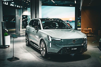 A sleek volvo suv is showcased in an indoor setting