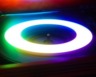 A neon ring illuminates a record player.