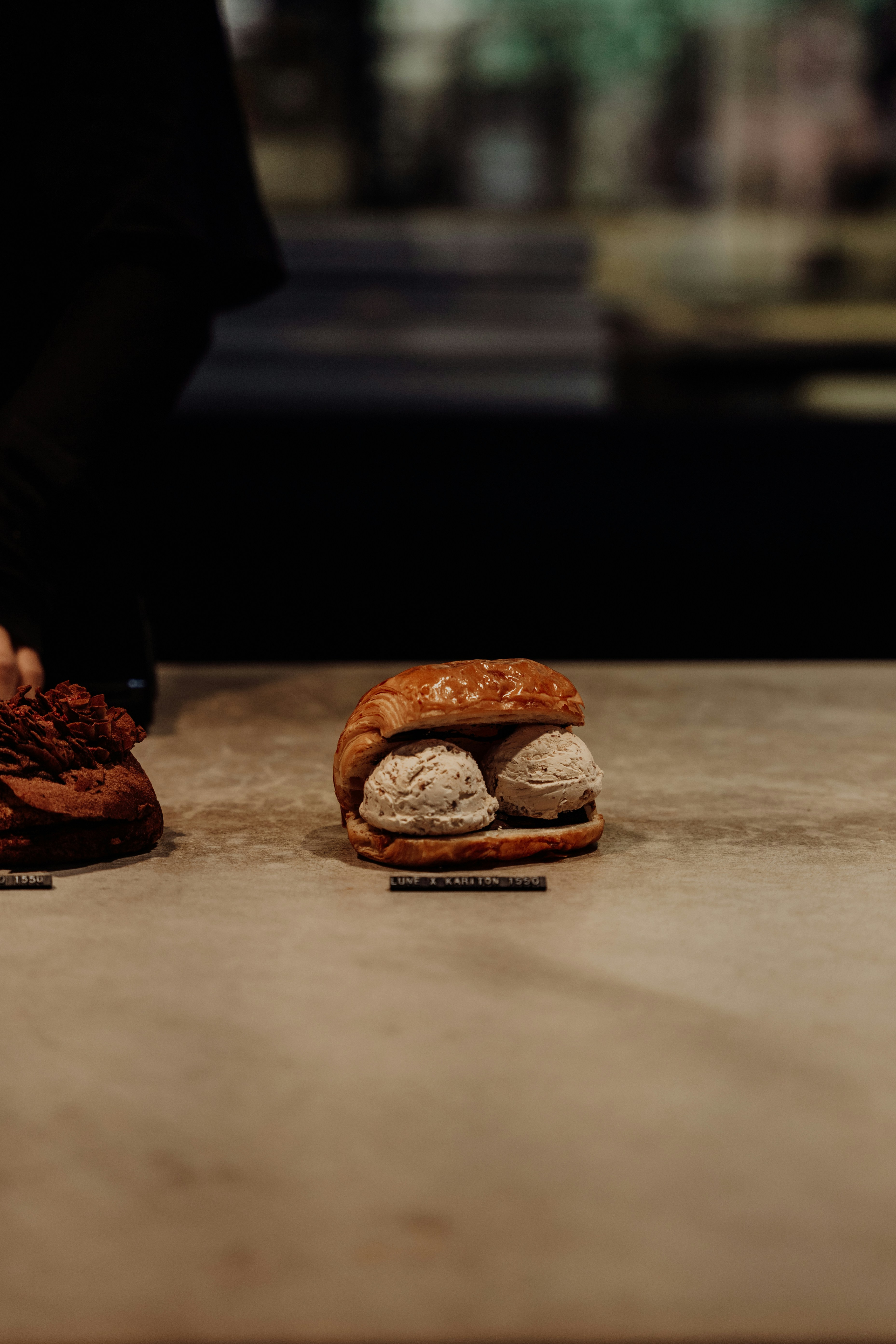 Ice cream sandwiches sit on a countertop.
