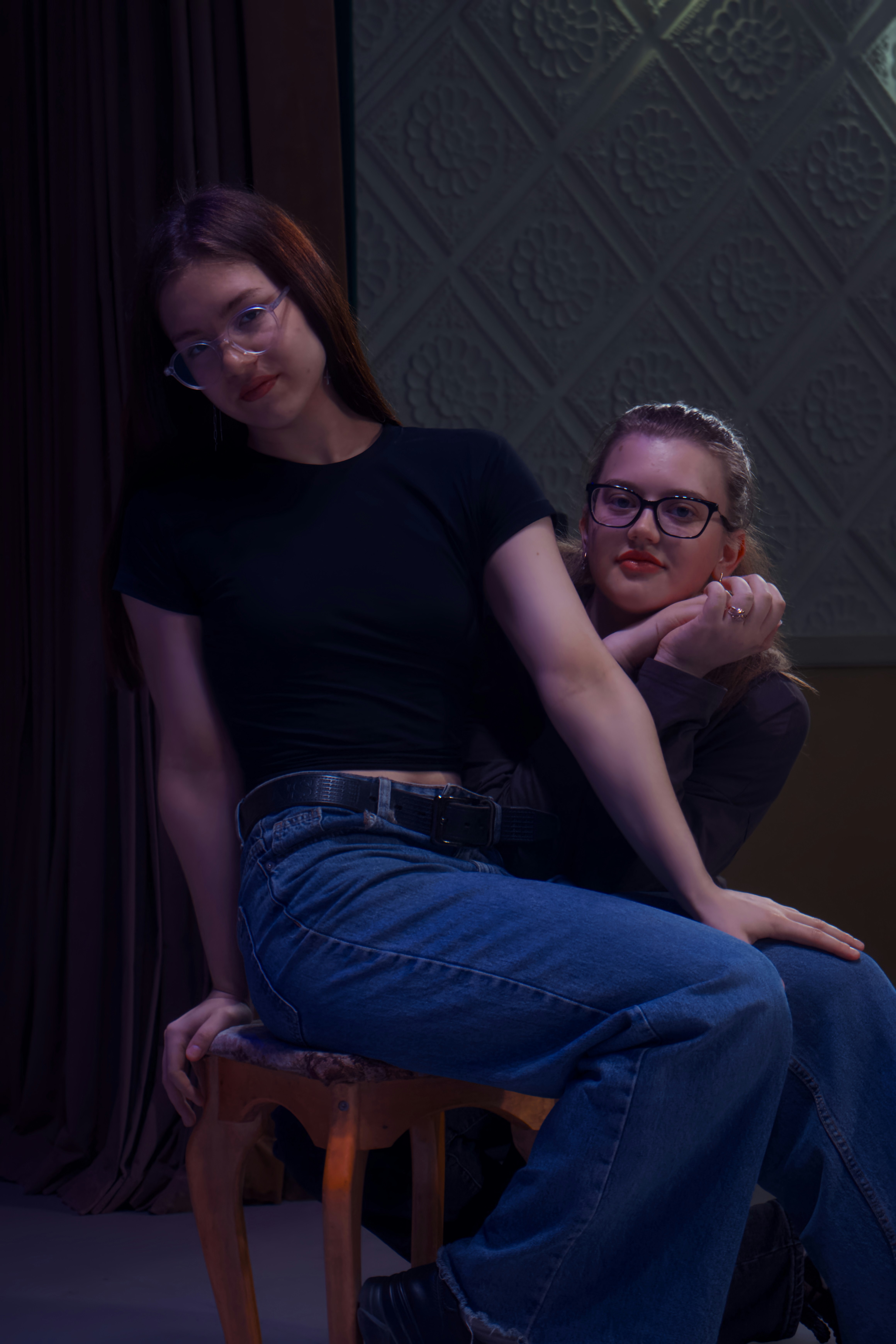 Two young women pose together for a picture.