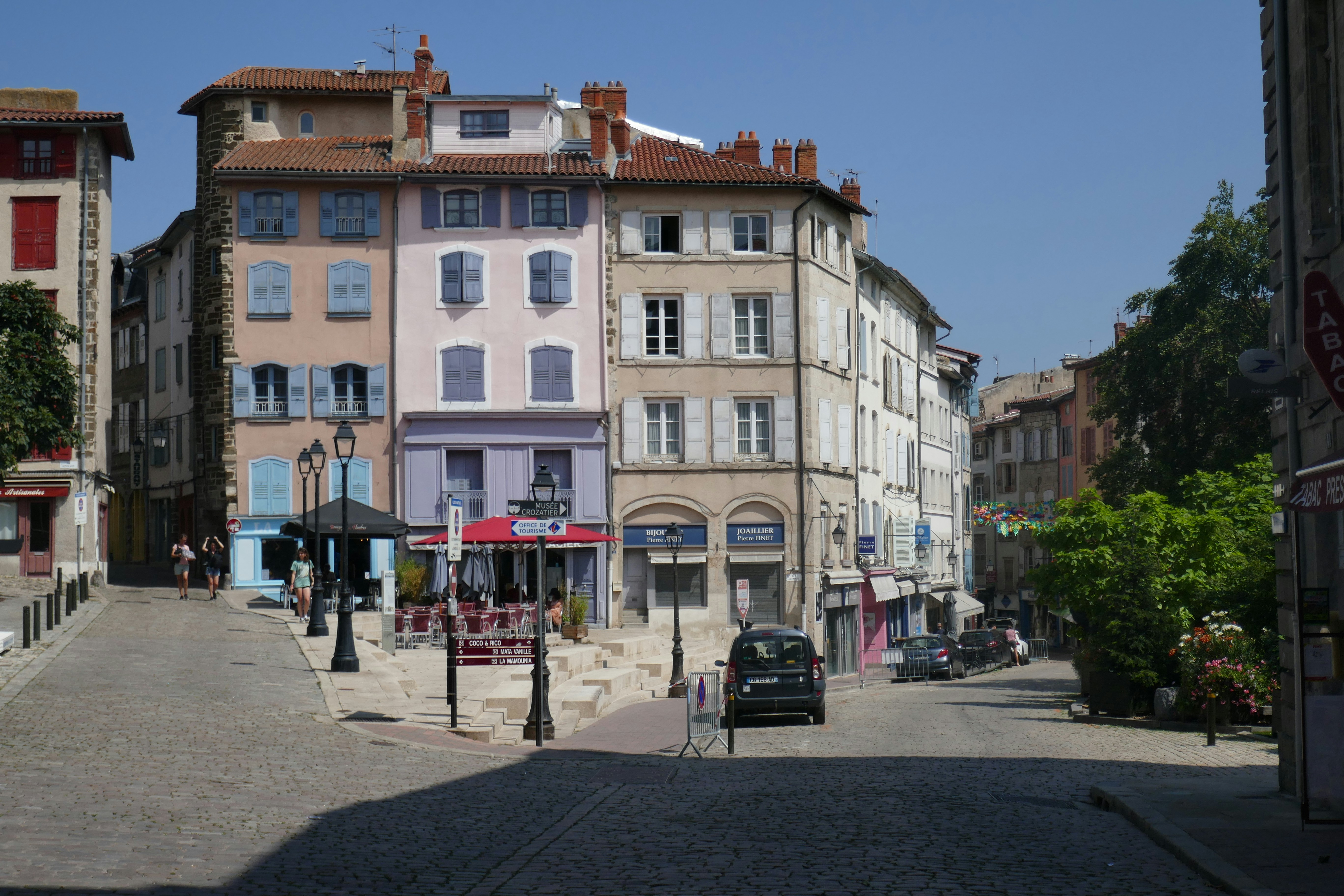 European buildings line a cobblestone street.