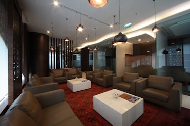 Lounge area with sofas and hanging lights.