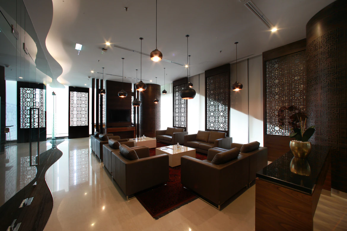 Modern lobby with seating, stylish lighting.