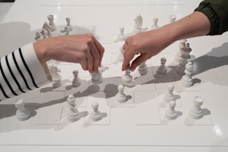 People are playing chess, making their moves.