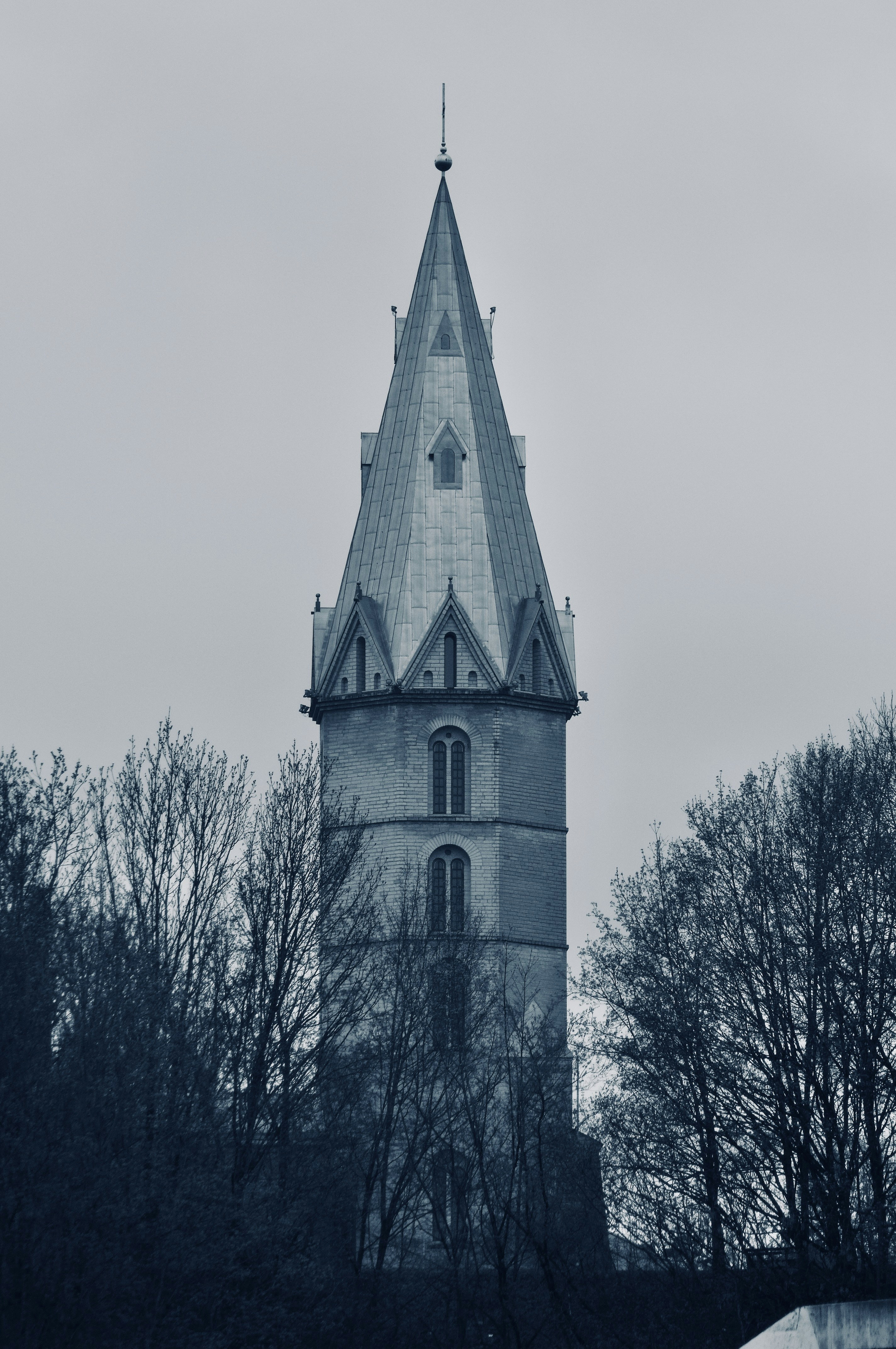 A tall, gothic tower reaches into the sky.