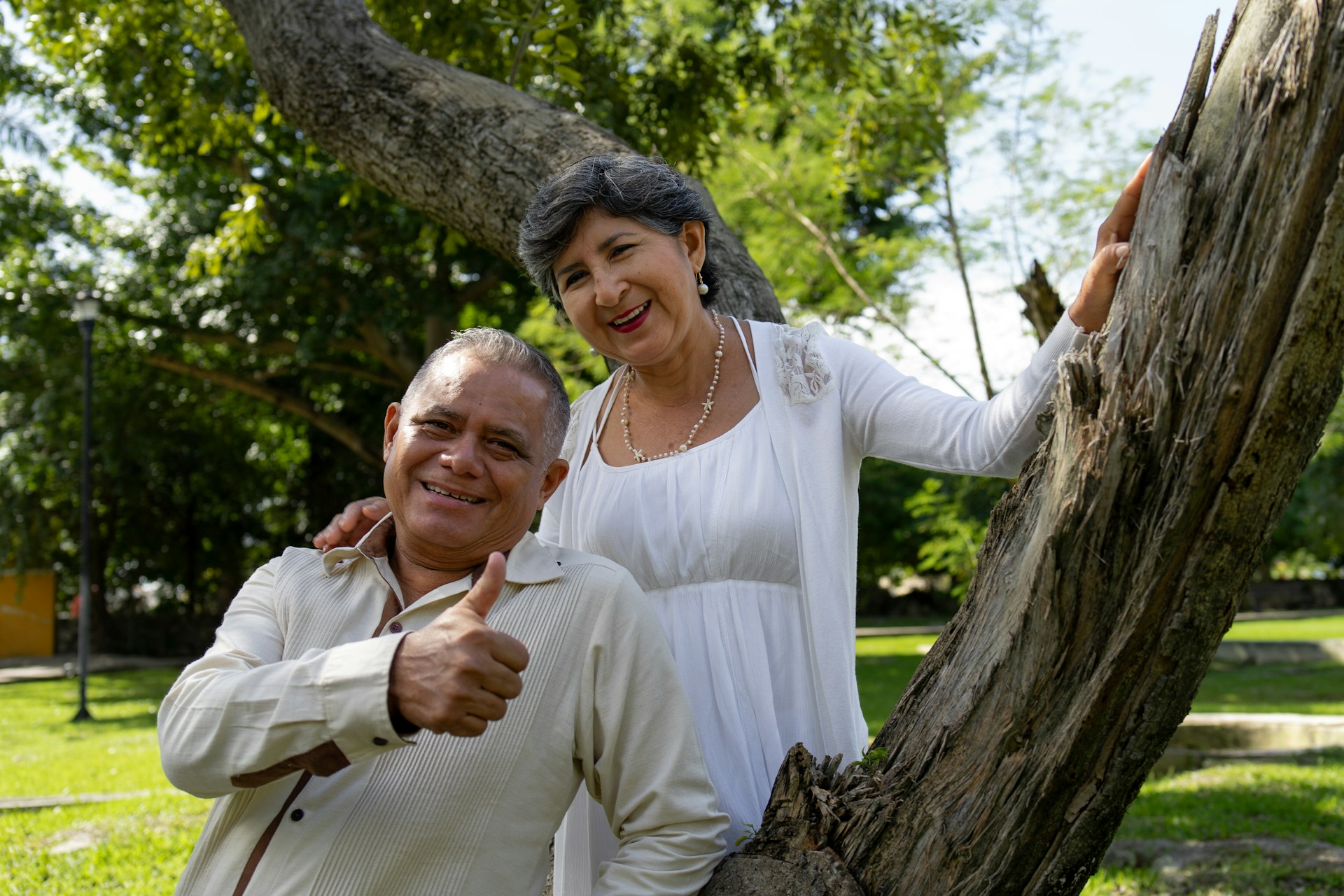 Happy senior couple poses for a photo outdoors.